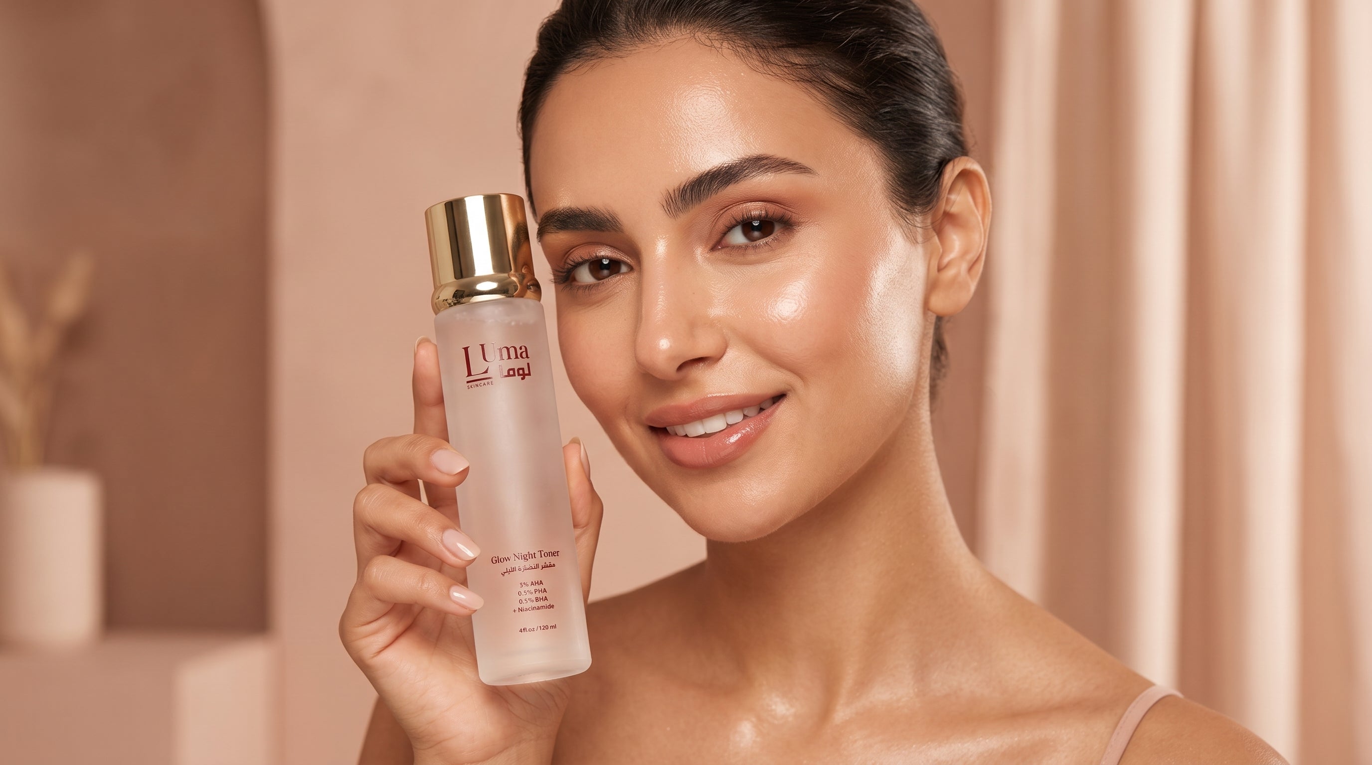 A woman holding a frosted glass bottle of Luma Glow Night Toner with a gold cap, set against a soft beige background with draped curtains.